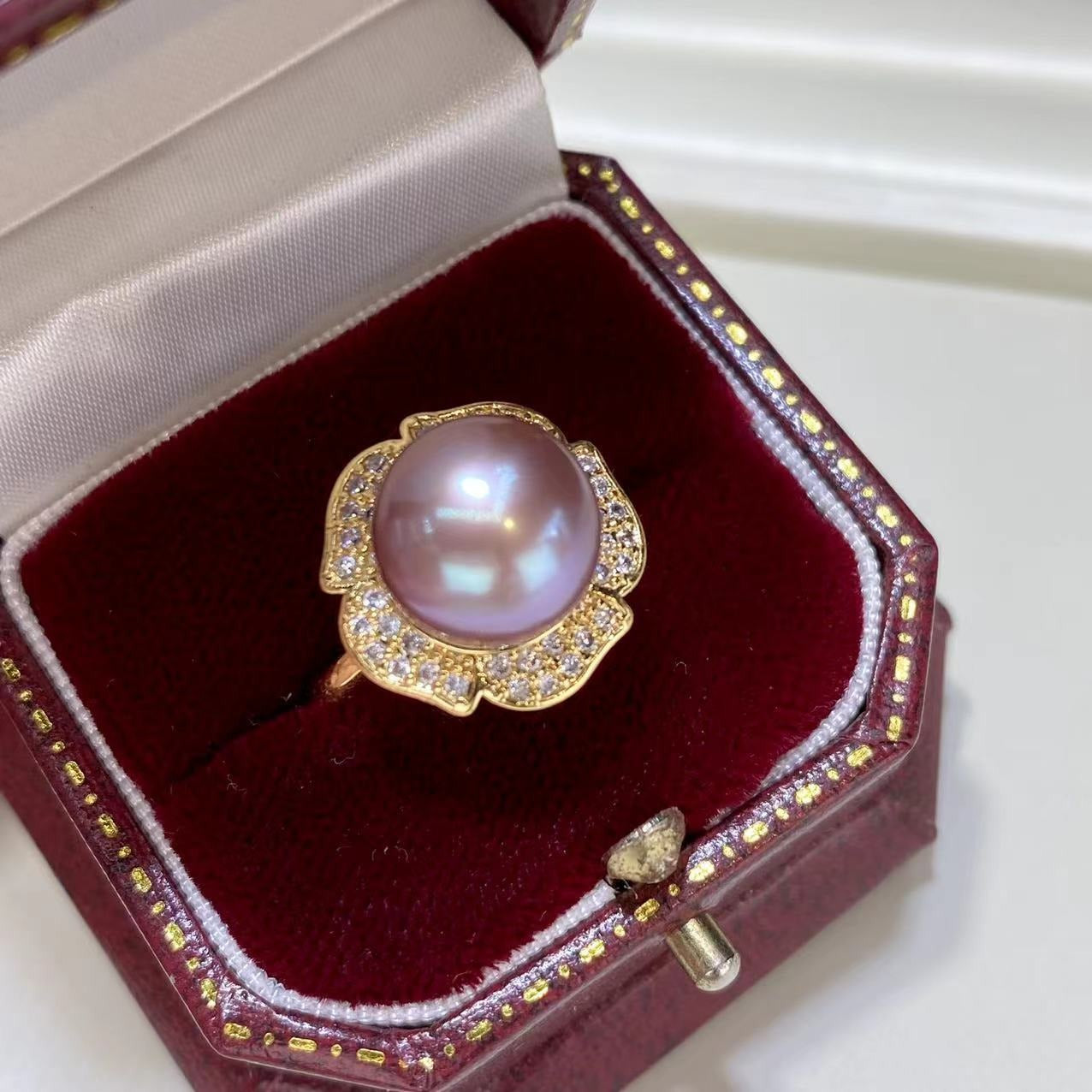 Luxury lavender jewelry set gold ring with large lavender pearl and surrounding crystals in red velvet box