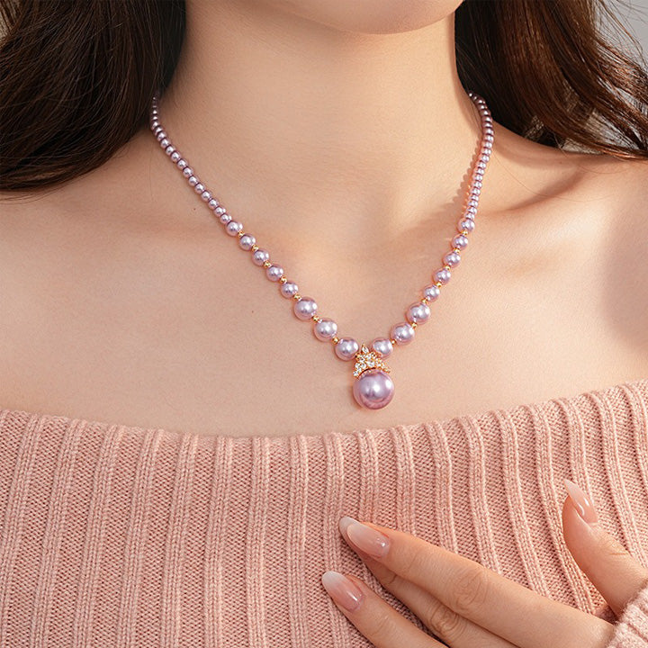 Luxury pearl jewelry set featuring a pink pearl necklace with a pendant from Truly Choose