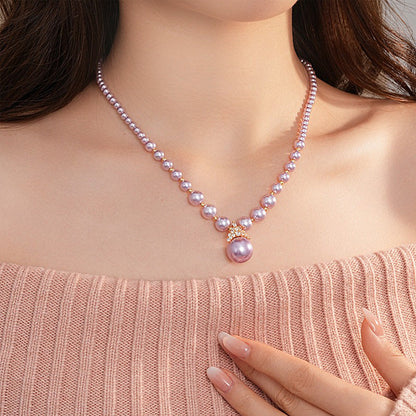 Luxury pearl jewelry set featuring a pink pearl necklace with a pendant from Truly Choose