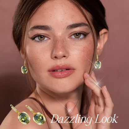 Woman wearing luxury peridot jewelry set with sparkling green gemstone earrings and matching ring
