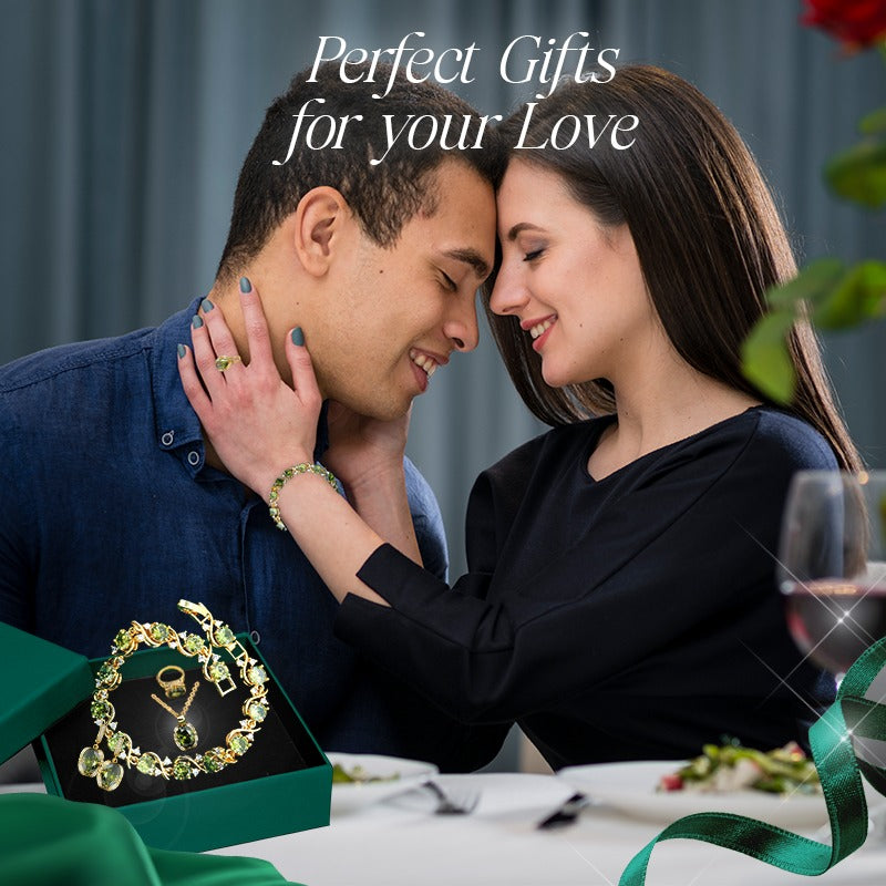 Romantic couple embracing with a luxury peridot jewelry set in a gift box on the table