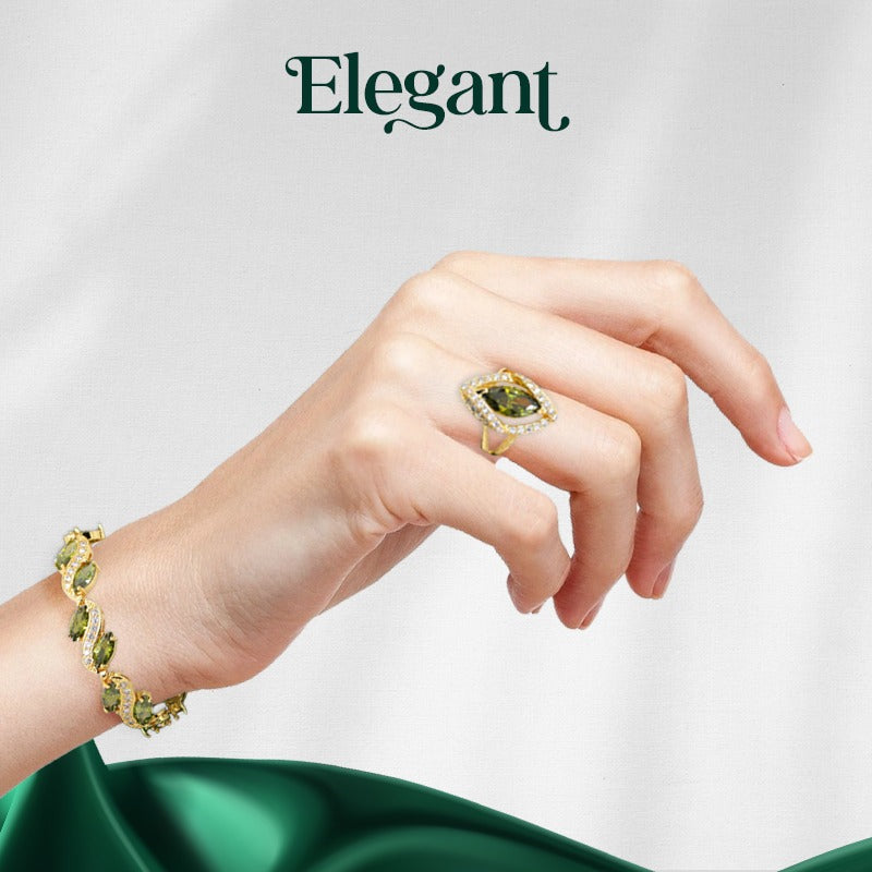 Luxury peridot jewelry set featuring a gold bracelet and ring with green peridot gemstones