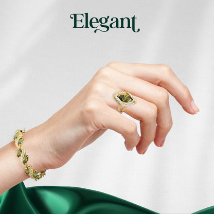 Luxury peridot jewelry set featuring a gold bracelet and ring with green peridot gemstones