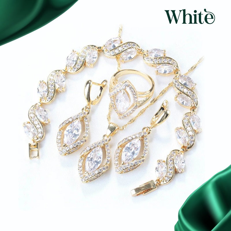 Luxury peridot jewelry set with gold-tone chain, earrings, ring, and bracelet featuring clear gemstones